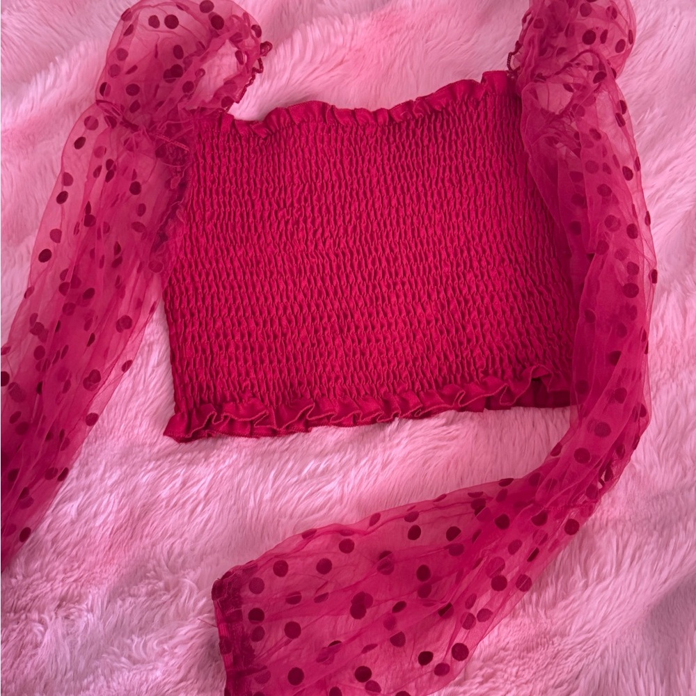 Elegant Pink Smocked Top with Sheer Polka Dot Sleeves